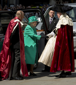 Queen Elizabeth II and Prince Philip Duke of Edinburgh attend a service to mark the 100th anniversary of the Order of the British Empire at St Paul s Cathedral in London.