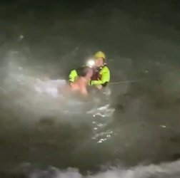 VIDEO Foolish man who went for night time swim in treacherous sea is saved by hero firefighters who dived in after him