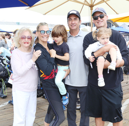 Molly Sims rides a stationary bike for charity