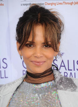 Pregnant at 50 Halle Berry cradles apparent baby bump at the Butterfly Ball