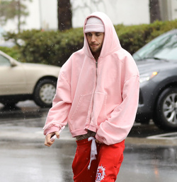 Disheveled Justin Bieber goes go karting in the rain