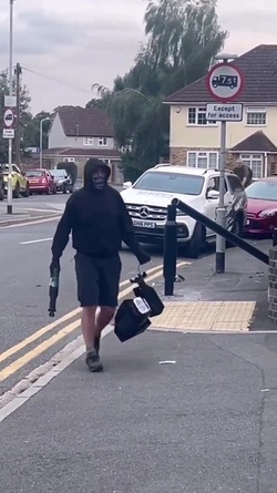 VIDEO Disgruntled masked man hacks down London ULEZ camera in broad daylight 48 hours after it was installed