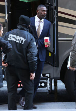 Idris Elba wears a Navy Blue Pinstriped Suit on set of Molly s Game in Toronto