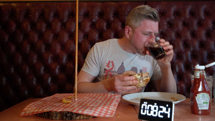Foodie Smashes Record For Huge Burger Tower Challenge Foodie Smashes Record For Huge Burger Tower Challenge