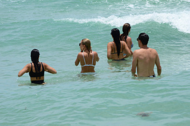 Hailey Baldwin and Kourtney Kardashian are seen out and about at the beach wearing bikinis on June 11 2017 in Miami Florida.