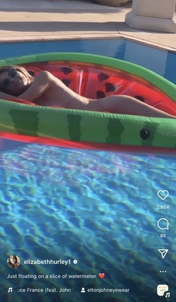 Liz Hurley poses totally nude on a slice of watermelon Liz Hurley poses totally nude on a slice of watermelon