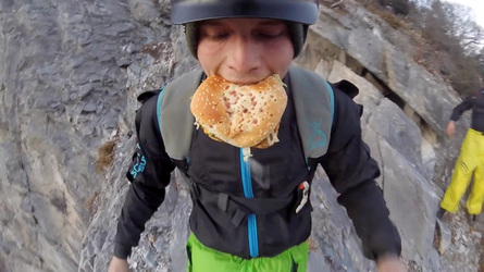 HAMBURGER AND FLIES HILARIOUS MOMENT BASE JUMPER OFF OFF THE SIDE OF A CLIFF WHILE EATING HIS LUNCH with video 