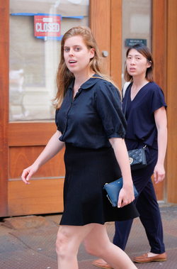 rincess Beatrice of York beats the heat in a short skirt as she walks in Soho