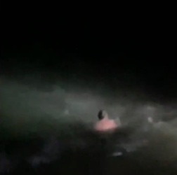 VIDEO Foolish man who went for night time swim in treacherous sea is saved by hero firefighters who dived in after him