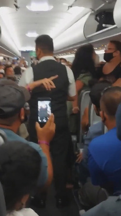 Drunk Plane Passenger Kicked Off For No Mask Rant
 Video available 
