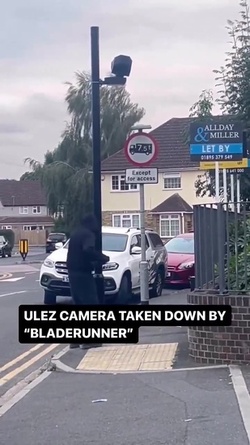 VIDEO Disgruntled masked man hacks down London ULEZ camera in broad daylight 48 hours after it was installed