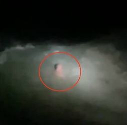 VIDEO Foolish man who went for night time swim in treacherous sea is saved by hero firefighters who dived in after him