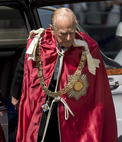 Queen Elizabeth II and Prince Philip Duke of Edinburgh attend a service to mark the 100th anniversary of the Order of the British Empire at St Paul s Cathedral in London.