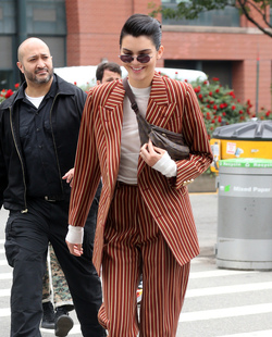 Kendall Jenner Accessorizes a Striped Suit with a Louis Vuitton Fanny Pack Kendall Jenner Accessorizes a Striped Suit with a Louis Vuitton Fanny Pack