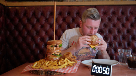 Foodie Smashes Record For Huge Burger Tower Challenge Foodie Smashes Record For Huge Burger Tower Challenge