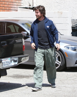 Christian Bale and his wife their their son out for breakfast