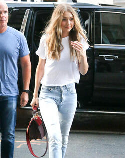 Gigi Hadid leaves her apartment in a plain white tee and red heels Gigi Hadid leaves her apartment in a plain white tee and red heels