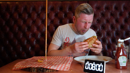 Foodie Smashes Record For Huge Burger Tower Challenge Foodie Smashes Record For Huge Burger Tower Challenge