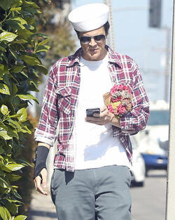 Johnny Knoxville Accesorizes with Sailor Hat and Wrist Brace