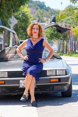 Claudia Wells Poses for Pictures Next to a Delorean