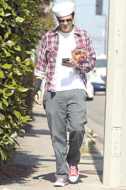 Johnny Knoxville Accesorizes with Sailor Hat and Wrist Brace