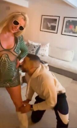 Britney Spears dances around in bed and gets licked by man Britney Spears dances around in bed and gets licked by man