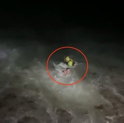 VIDEO Foolish man who went for night time swim in treacherous sea is saved by hero firefighters who dived in after him