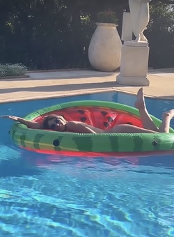 Liz Hurley poses totally nude on a slice of watermelon Liz Hurley poses totally nude on a slice of watermelon