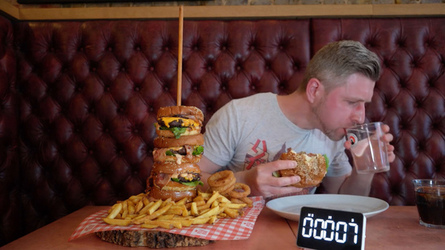 Foodie Smashes Record For Huge Burger Tower Challenge Foodie Smashes Record For Huge Burger Tower Challenge