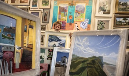Sophie Miller of the Llewellyn Alexander gallery in Waterloo sifts through the approximately 600 works of art that has been rejected from the annual prestigious Royal Academy exhibition Sophie Miller of the Llewellyn Alexander gallery in Waterloo sifts through the approximately 600 works of art that has been rejected from the annual prestigious Royal Academy exhibition
