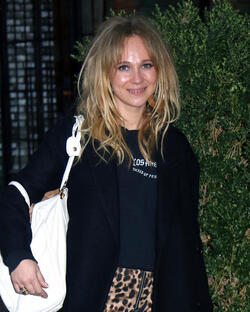 Juno Temple is pictured chatting on a cellphone outside her hotel in New York City.