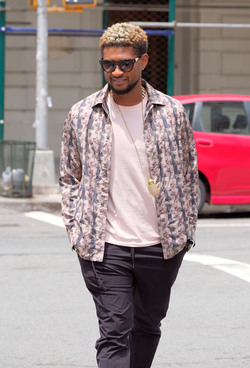 Usher wears comical slippers as he walks in Tribeca