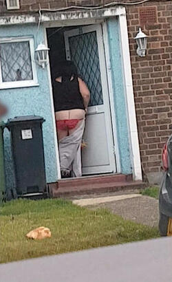 A bottomless woman was spotted stumbling into her house in broad daylight A bottomless woman was spotted stumbling into her house in broad daylight