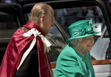 Queen Elizabeth II and Prince Philip Duke of Edinburgh attend a service to mark the 100th anniversary of the Order of the British Empire at St Paul s Cathedral in London.
