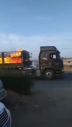 Moment Hero Driver Speeds Out Of Town In Burning Lorry
 video available 