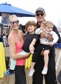 Molly Sims rides a stationary bike for charity