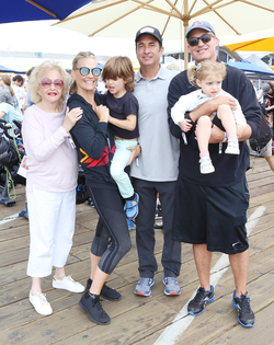 Molly Sims rides a stationary bike for charity
