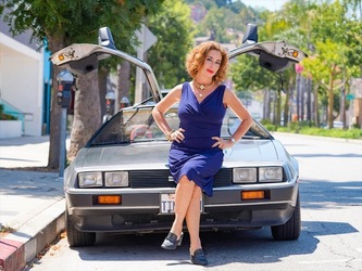 Claudia Wells Poses for Pictures Next to a Delorean