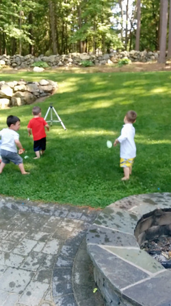 KID THROWS WATER BALLOON KID THROWS WATER BALLOON
