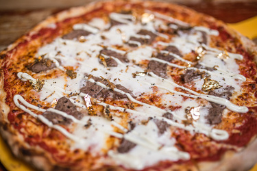 A LOT OF CHEDDAR NEW 2 500 CALORIE PIZZA IS TOPPED WITH 24K GOLD