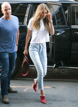 Gigi Hadid leaves her apartment in a plain white tee and red heels Gigi Hadid leaves her apartment in a plain white tee and red heels