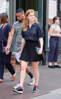 rincess Beatrice of York beats the heat in a short skirt as she walks in Soho