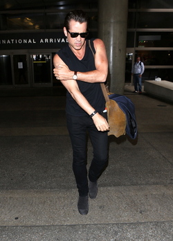Colin Farrell was spotted in a sleeveless t shirt at LAX