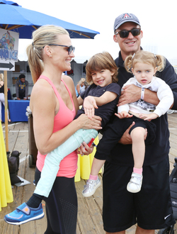 Molly Sims rides a stationary bike for charity