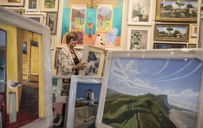 Sophie Miller of the Llewellyn Alexander gallery in Waterloo sifts through the approximately 600 works of art that has been rejected from the annual prestigious Royal Academy exhibition Sophie Miller of the Llewellyn Alexander gallery in Waterloo sifts through the approximately 600 works of art that has been rejected from the annual prestigious Royal Academy exhibition
