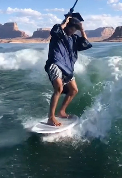 HIGH SCHOOL GRADUATE TAKES UNIQUE GRADUATION PHOTOS WHILE WAKESURFING