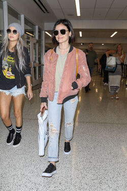 Pretty Little Liars star Lucy Hale looks cute in a rose colored silk bomber light green tee ripped jeans and black tennis shoes as she touches down in L.A. after a long flight from NYC. Pretty Little Liars star Lucy Hale looks cute in a rose colored silk bomber light green tee ripped jeans and black tennis shoes as she touches down in L.A. after a long flight from NYC.