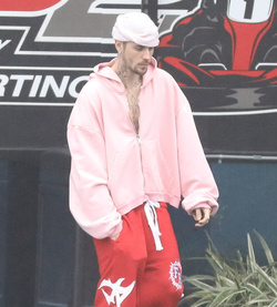 Disheveled Justin Bieber goes go karting in the rain