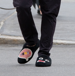 Usher wears comical slippers as he walks in Tribeca