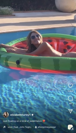 Liz Hurley poses totally nude on a slice of watermelon Liz Hurley poses totally nude on a slice of watermelon